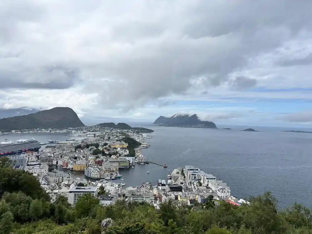 Coastal town with mountains and islands from elevated viewpoint