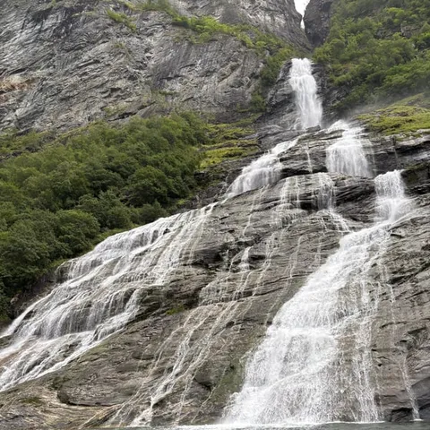 A waterfall falling into the Geirangerfjord